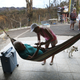 Irma Maldanado checks on her father, Ignacio Maldanado Ortiz, who uses an oxygen machine because of his emphysema on Oct. 2, 2017, in Corozal, Puerto Rico. Irma Maldanado said her father is in need of oxygen but has no way of getting a supply in the aftermath of Hurricane Maria. (Joe Raedle/Getty Images)
